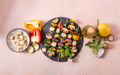 Skewers with vegetables and tofu on grill frying pan, ingredients for vegan grilling, clean eating - 320817274