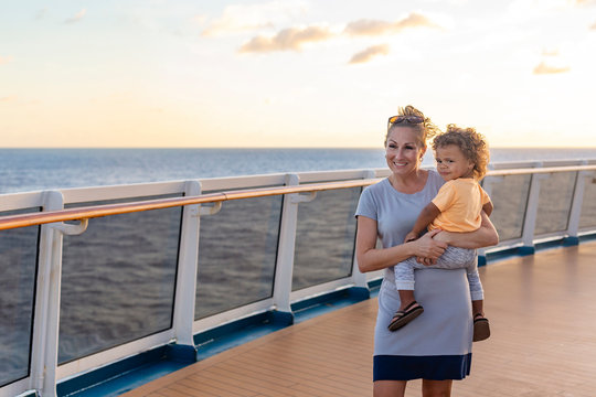A mother and her son enjoying a Caribbean Cruise vacation together. Candid photo of a family enjoying their time on board a cruise ship together.