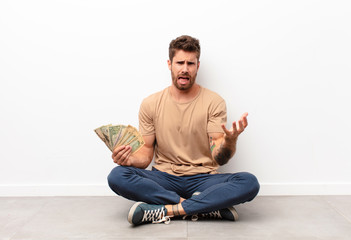looking angry, annoyed and frustrated screaming wtf or what‚Äôs wrong with you holding dollar...