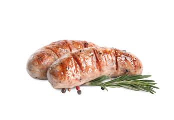 Grilled sausages and rosemary isolated on white