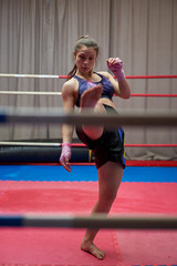 Female kickboxer shadow boxing
