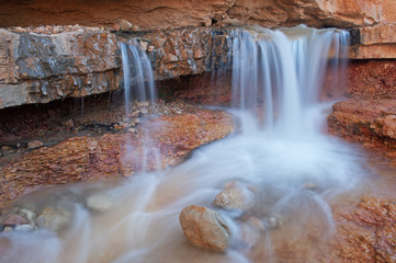Landscape of a waterfall captured with motion blur, Mossy Cave section of Bryce Canyon National Park, Utah, USA