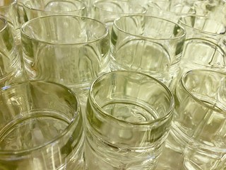 Partially blurred empty glasses in a bar