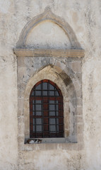 old window in stone wall
