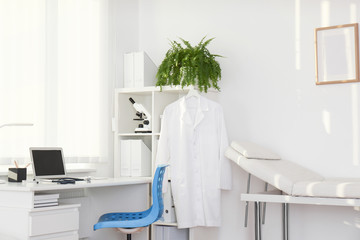 Interior of modern medical office with doctor's workplace