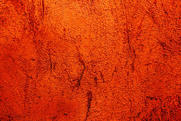 Orange colored abstract wall background with textures of different shades of orange