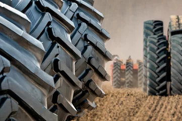 Deurstickers Stack of brand new tractor and loader tires © Andrej