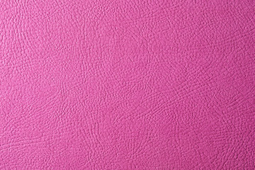 Texture of pink leather as background, closeup