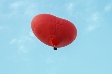 Flying a balloon in the shape of a heart