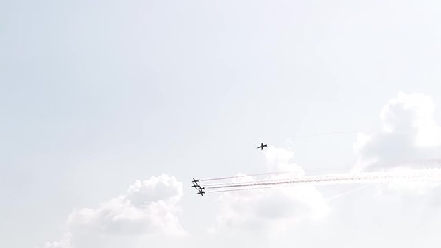 Five fighter jets in the blue sky. A general plan. Aerobatic figures. Airshow. 10 seconds