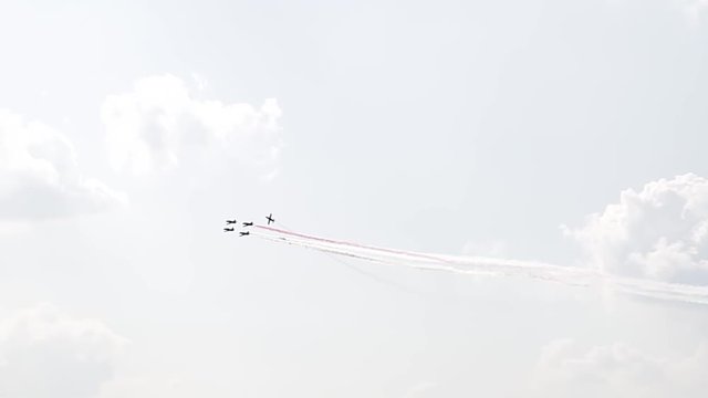 Five fighter jets in the blue sky. A general plan. Aerobatic figures. Airshow. 10 seconds
