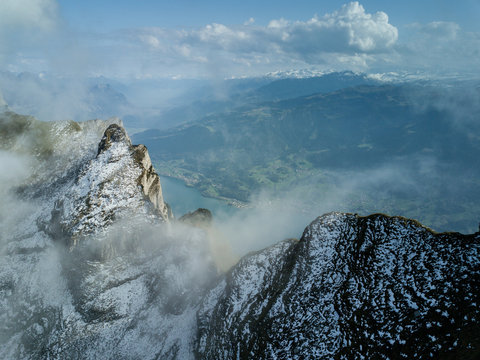 Snowy alpine peaks aerial by Wallensee, Switzerland
