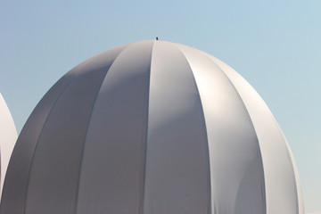 White inflated domes, used as temporary tents.