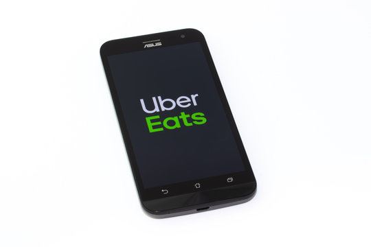 Kouvola, Finland - 23 January 2020: Uber eats app logo on the screen of smartphone Asus
