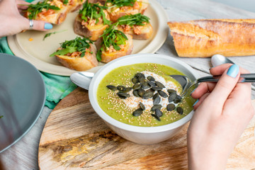 delicious Brussels sprouts cream soup, scooped into a spoon