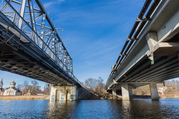 City, Riga, Latvia. River with train bridge with iron construction. Travel photo. 04.02.2020