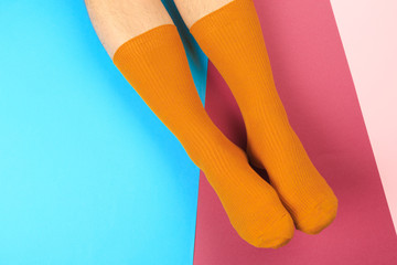 legs in colorful socks on colorful  background - Image