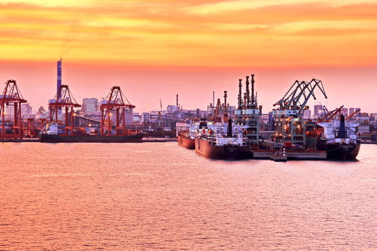 Panoramic night views of piers, sea vessels, tugboats and the city of Rizhao, China.