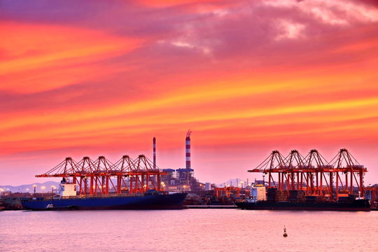 Panoramic night views of piers, sea vessels, tugboats and the city of Rizhao, China.
