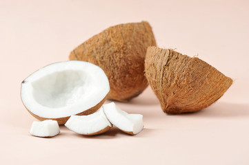 Coconut and coconut shell. The concept of products for a healthy diet. Light background. Close-up. Macro shot.