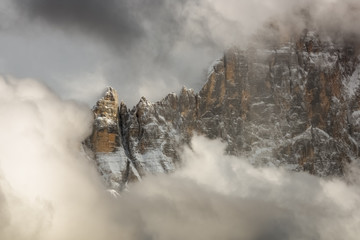 The north-west wall of the Civetta mount wrapped in stormy cloud, dolomites, Italy