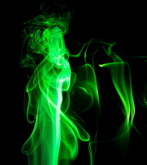Obraz premium Green smoke on black background