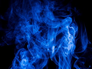 Blue smoke on black background