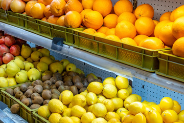 Various fruits in the market for sale.