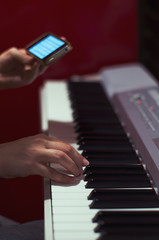 hands playing piano