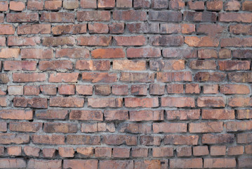 The texture of the brickwork of red brick.