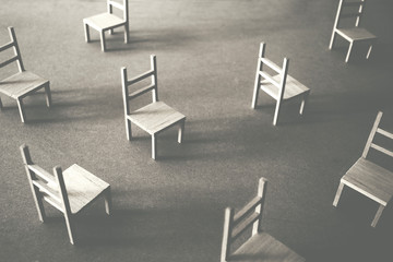 many wooden chairs in chaotic disposition