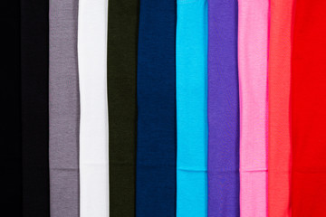 Naklejka premium Close up Stack of Colorful cotton T shirt for bacground