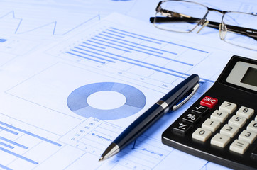 Business analytics, graphs and charts. A schematic drawing on paper. Manager's workplace