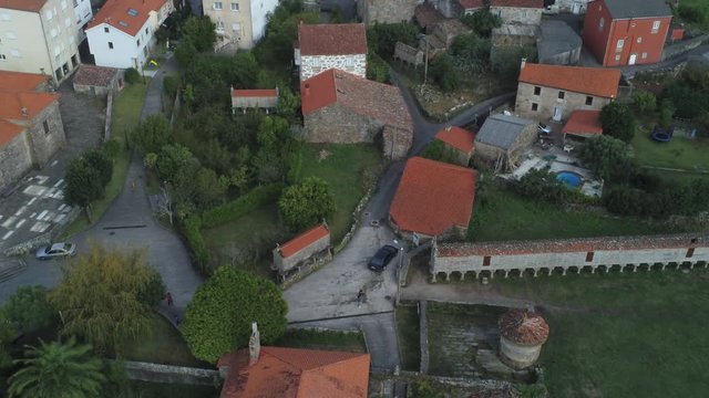 View of the horreo de carnota ( long grain storage container ) and residential area of the city of Carnota, Spain, Europe