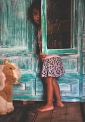 Cute little Mexican girl. Childhood. Portrait of young girl, Mexican ethnicity, outside.