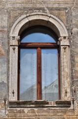 Detail of the window on the historical Cazuffi-Rella houses, Trento, Italy