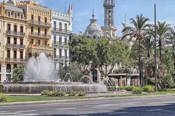 Fototapeta na wymiar The fountain in Plaza del Ayuntamiento, Valencia, Spain