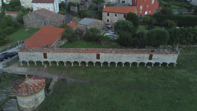 Aerial view of the horreo de carnota ( long grain storage container ) and residential area of the city of Carnota, Spain, Europe