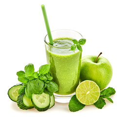 Freshly blended green fruit smoothie in glass, healthy detox vitamin diet food concept. Raw vitamins breakfast smoothie drink. Greens, basil, apple, cucumber for smoothie isolated on white.