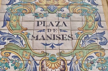 Ceramic tiles street sign of the Manises square in Valencia, Spain