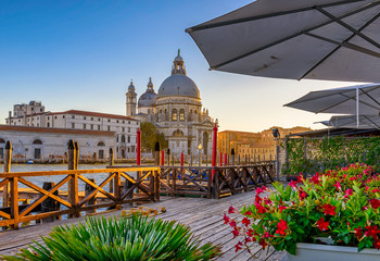 Canal Grande with Venice gondola and Basilica di Santa Maria della Salute in Venice, Italy. Architecture and landmarks of Venice. Venice postcard © Ekaterina Belova