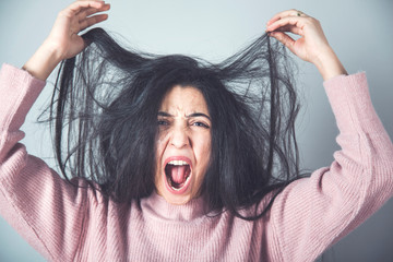 angry woman hand hair
