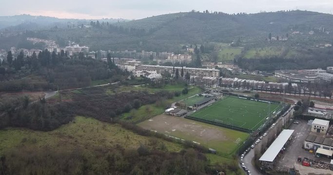 Belmonte amateur and professional soccer team stadium. Antella, Bagno a Ripoli , south side of Florence. Tuscany , Italy. Aerial wide dolly in shot