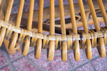 back of an old yellow wicker chair