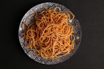 plate of spaghetti pasta with tomato