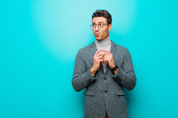 young arabian man scheming and conspiring, thinking devious tricks and cheats, cunning and...