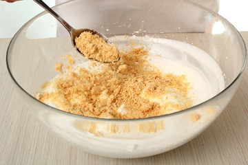 Fold nut mixture into whipped egg whites. Making Chocolate Hazelnut Meringue Cake.