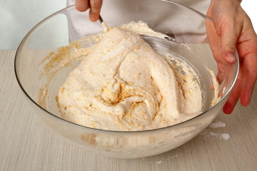 Fold nut mixture into whipped egg whites. Making Chocolate Hazelnut Meringue Cake.