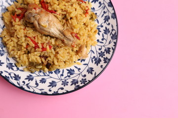 plate of rice with chicken and peppers