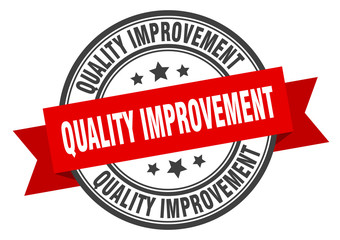 Obraz premium quality improvement label. quality improvementround band sign. quality improvement stamp